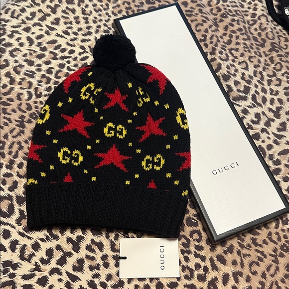 Gucci Accessories - Gucci winter hat Black with Red and Yellow Stars